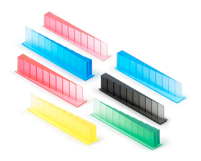 Translucent color test strips in red, pink, blue, yellow, black and green, each showing lighter to deeper shades.